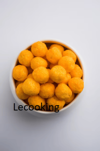 cheese flavoured puffs balls closeup served bowl moody background 466689 57816