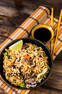 elevated view fried stir noodles with soya sauces chopsticks placemat 23 2148093326