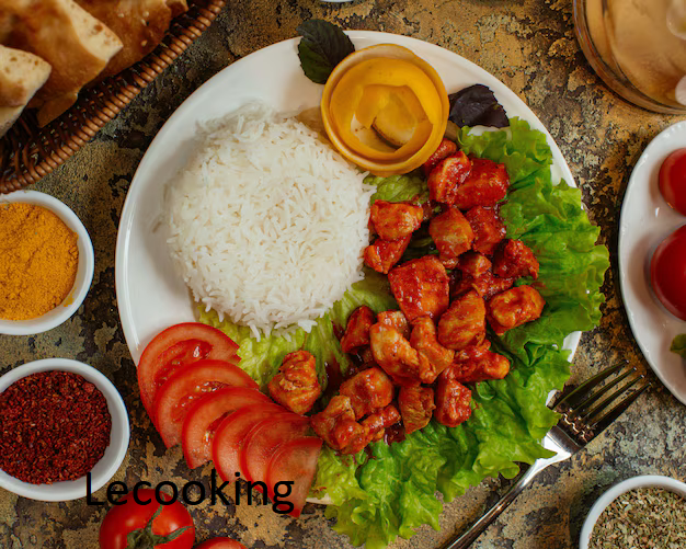 chicken dish with chicken pieces tomato sauce served with rice tomatoes 140725 3888