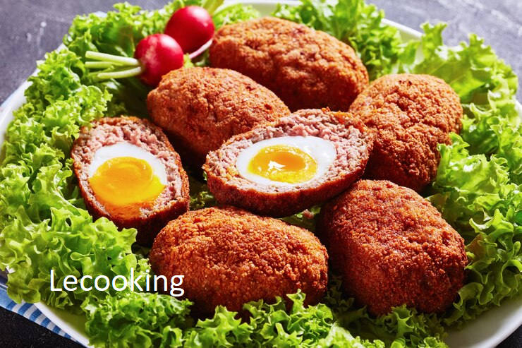 close up scotch eggs soft boiled eggs with runny yolk wrapped minced sausage served with lettuce leaves radish plate macro 268847 1219 1